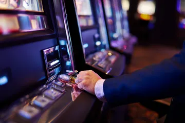 A laptop glowing with a bright login prompt in a minimalistic setup, symbolizing the protected access system at OLYMP.